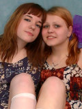 Good pics of two lesbians pushing long cucumbers inside their little nasty slits