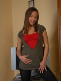 Brunette teen slowly stripping