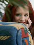 Horny redhead slowly stripping