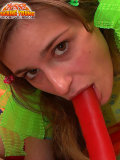 Two fresh faced cuties showing you their perky tits and fucking with a big red toy